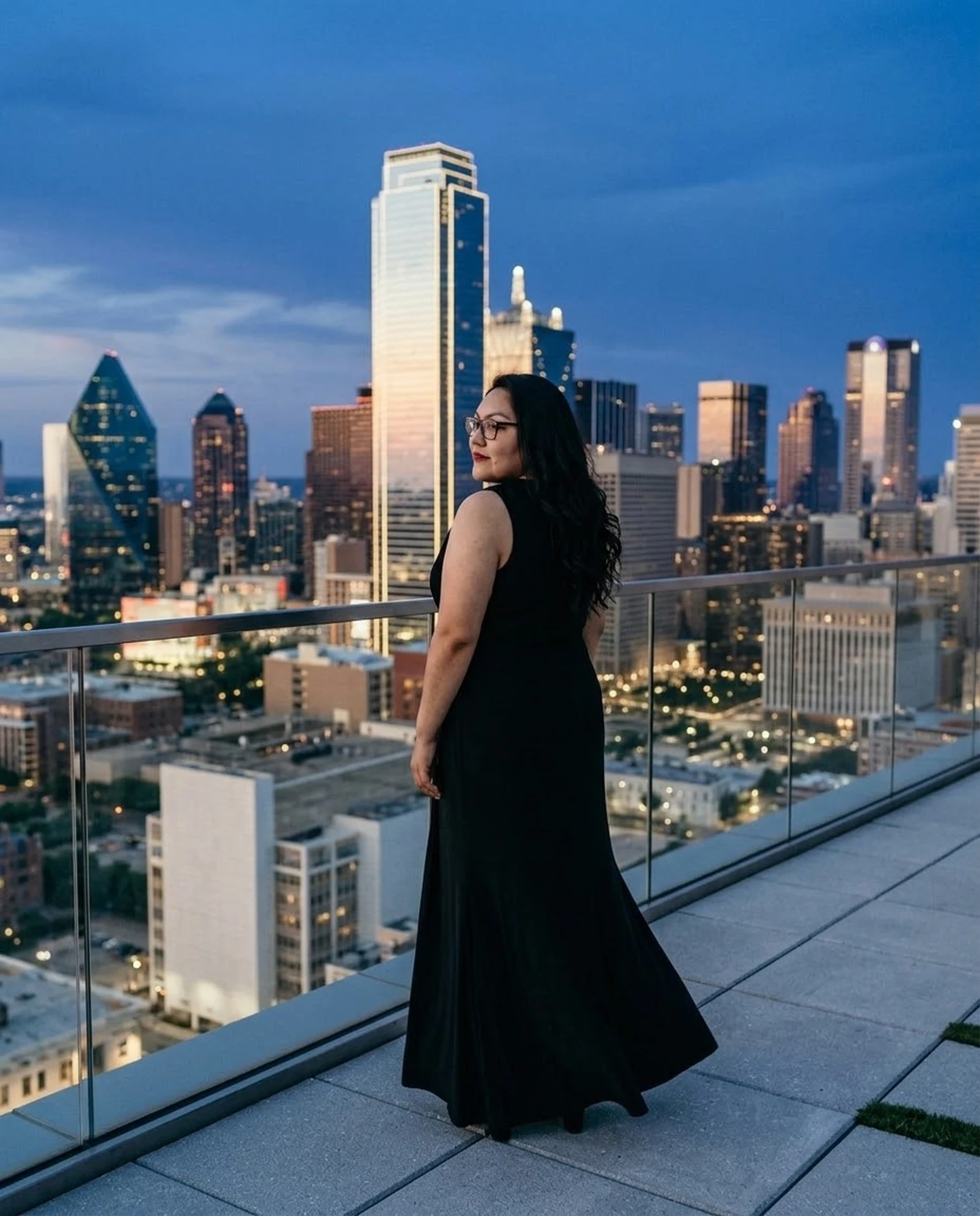 Liz looking back over the Dallas skyline at blue hour